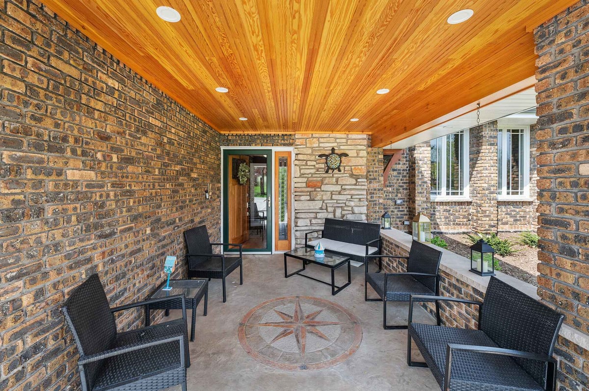 Exterior home front entry porch with wood ceiling