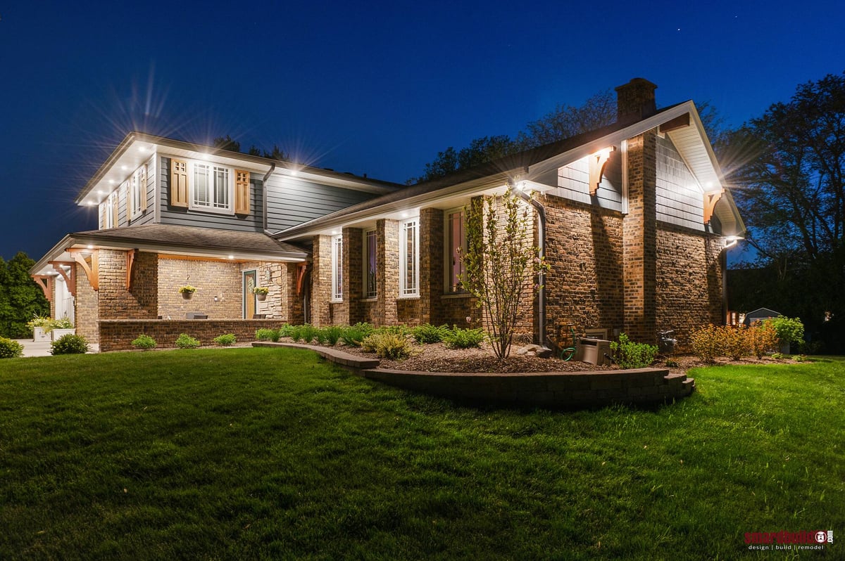 exterior view of home with brick and blue James Hardie siding